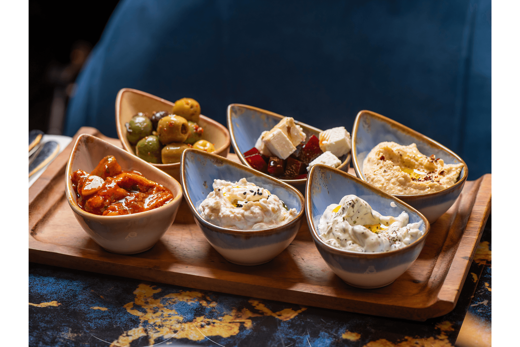 Mediterranean mezze platter with hummus, olives and flatbread at Opuz Aylesbury