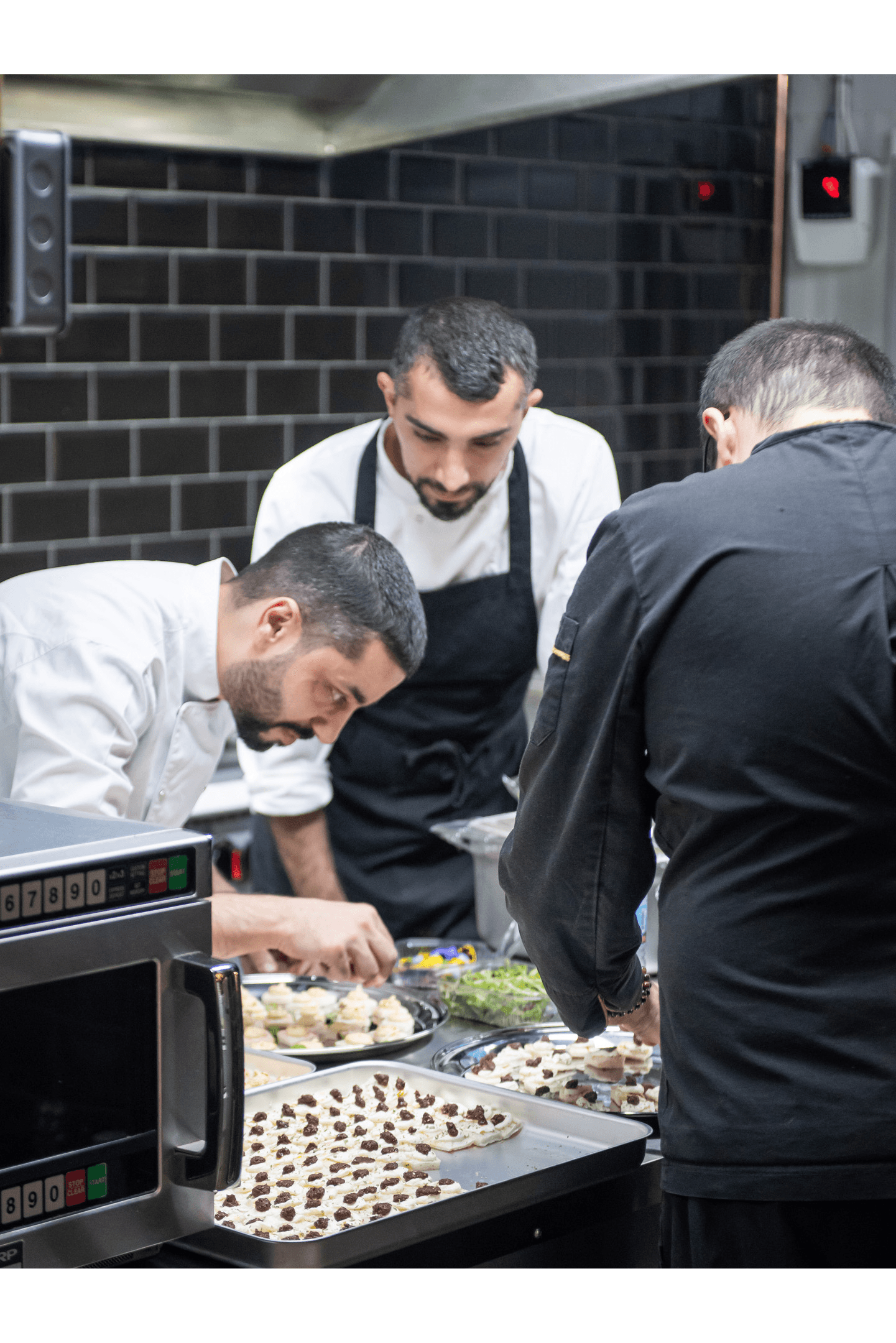 Chef plating a dessert with precision at Opuz Aylesbury