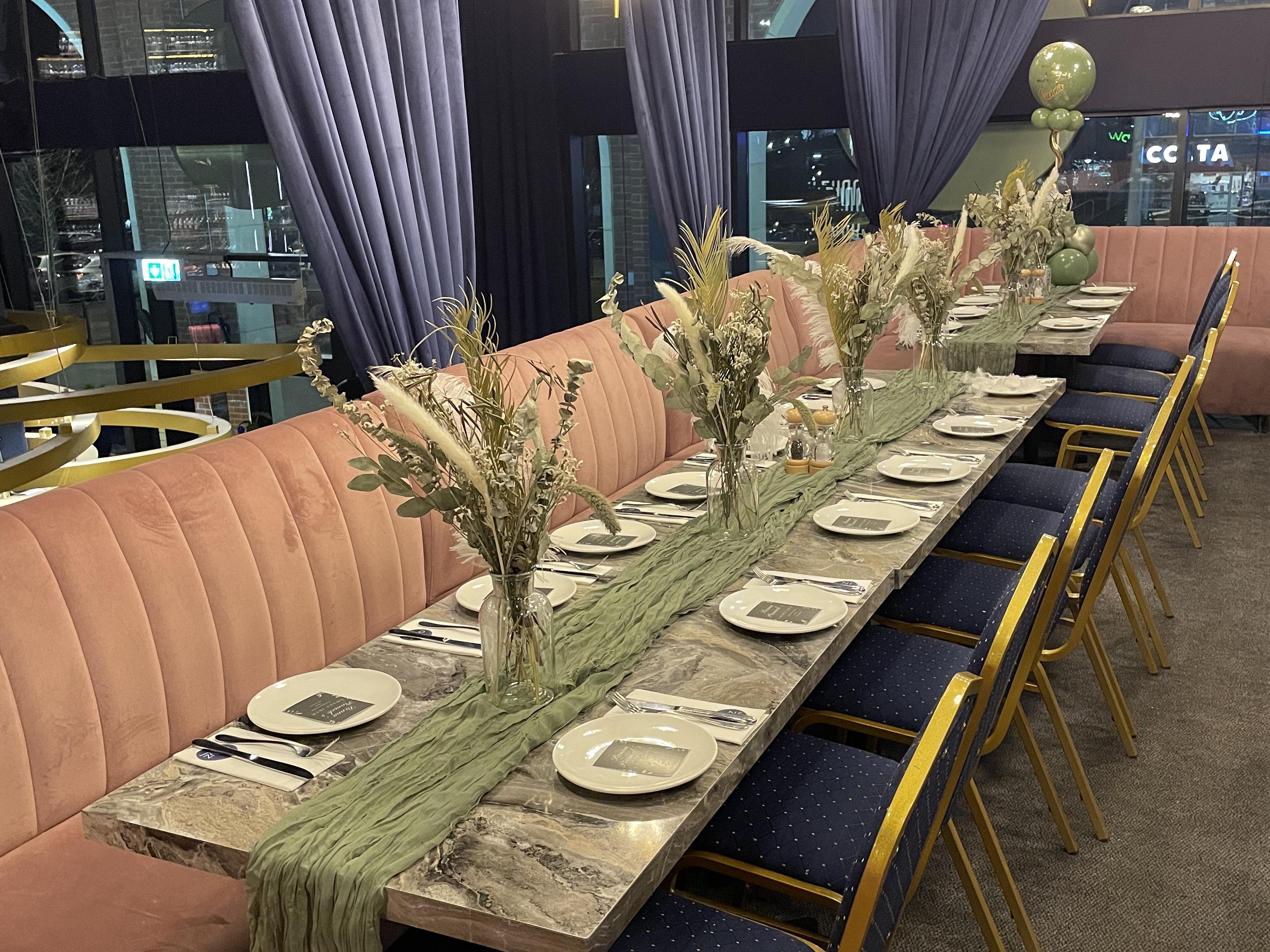 Dining table set with place settings and candles